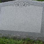 Stock #07
Carved rosette with leaves, polished face, serp top, sawn back
Barre Gray granite
24" x 10" x 18" slant